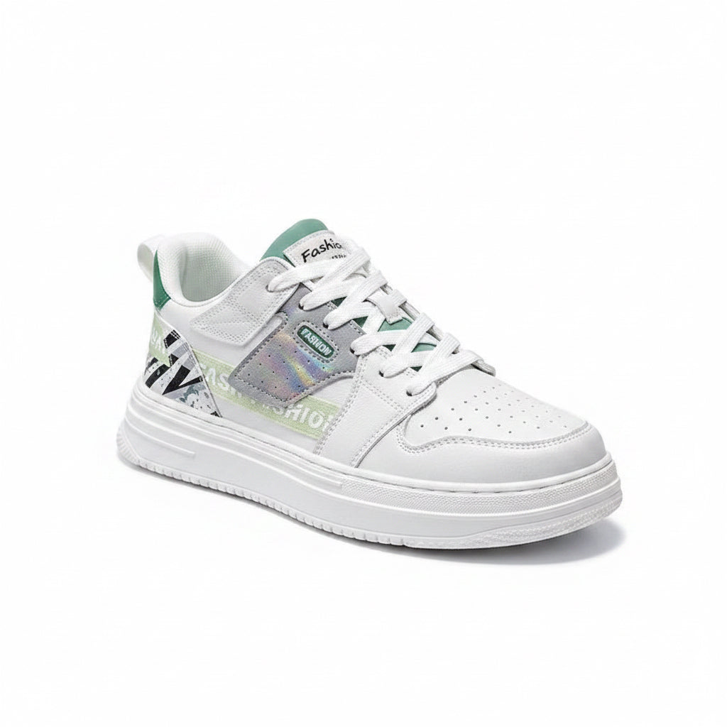 White sneakers with gray and green accents on a gray surface
