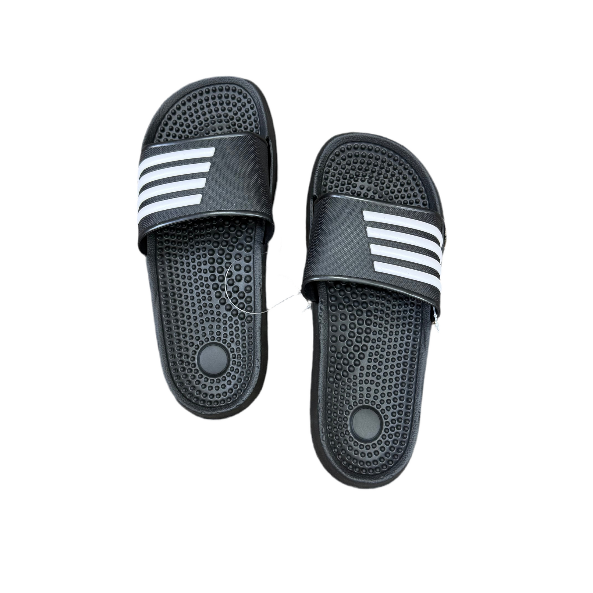 Pair of black slides with white stripes on a white background
