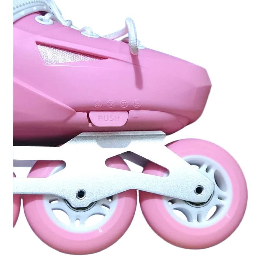 Pink roller skates with white wheels on a blue background
