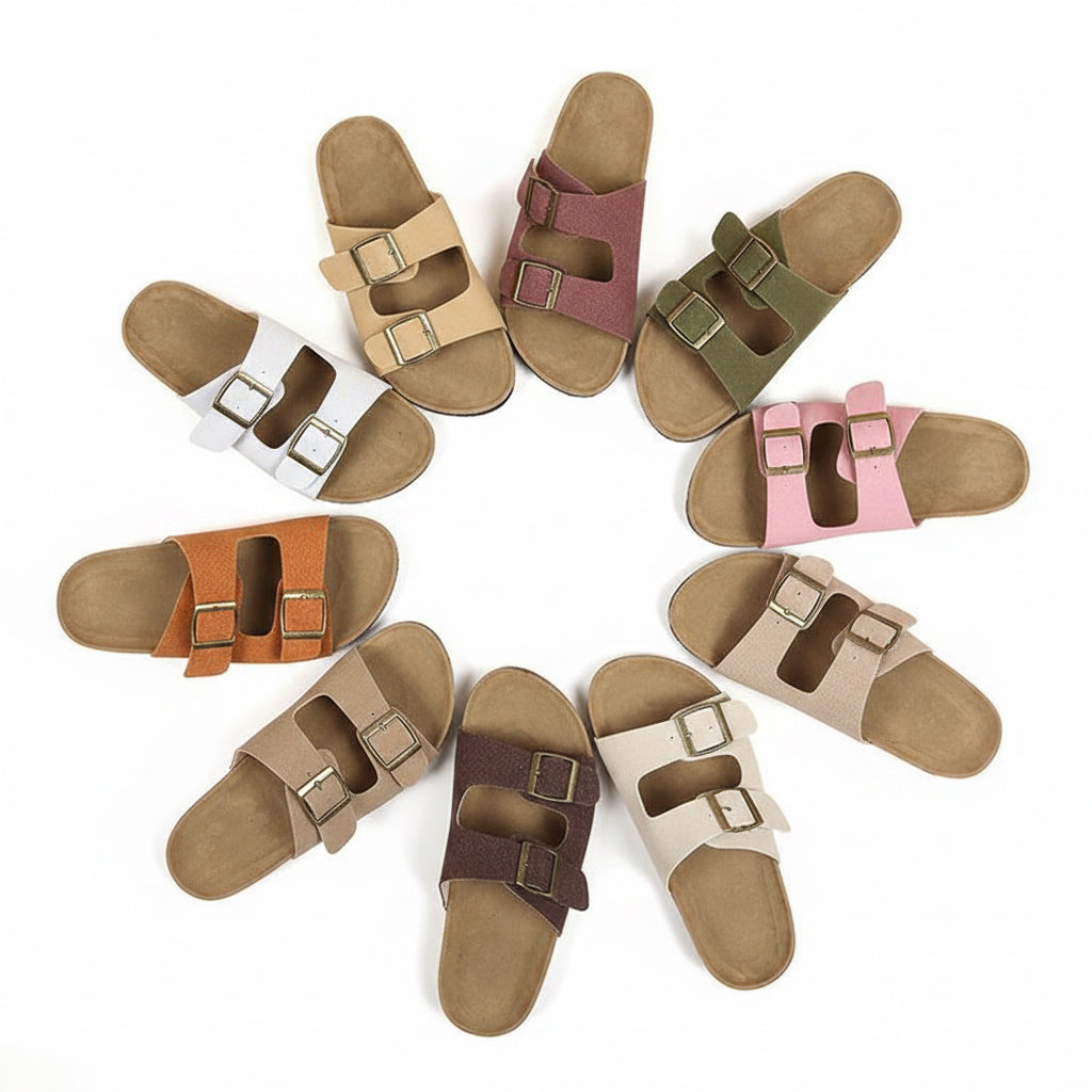 Collection of multicolored sandals with buckles on a beige background