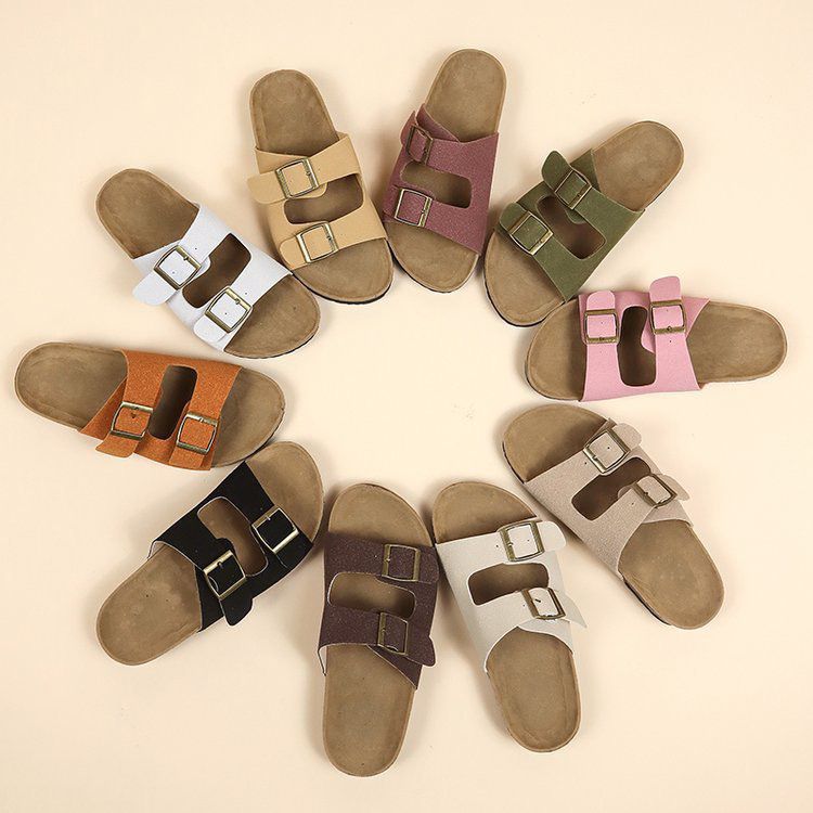 Collection of multicolored sandals with buckles on a beige background