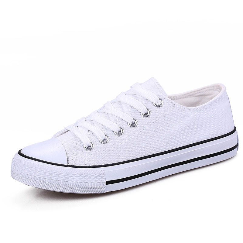 White sneaker with black accents on a white background