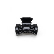 Black plastic component on a white background