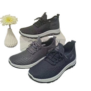 Pair of gray sneakers with white soles on a white background