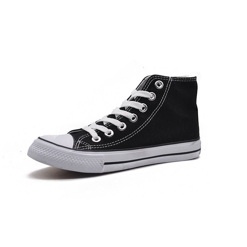 Black high-top sneaker with white laces on a white background