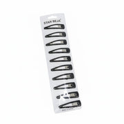 Pack of black hair clips on a white background with visible brand name.