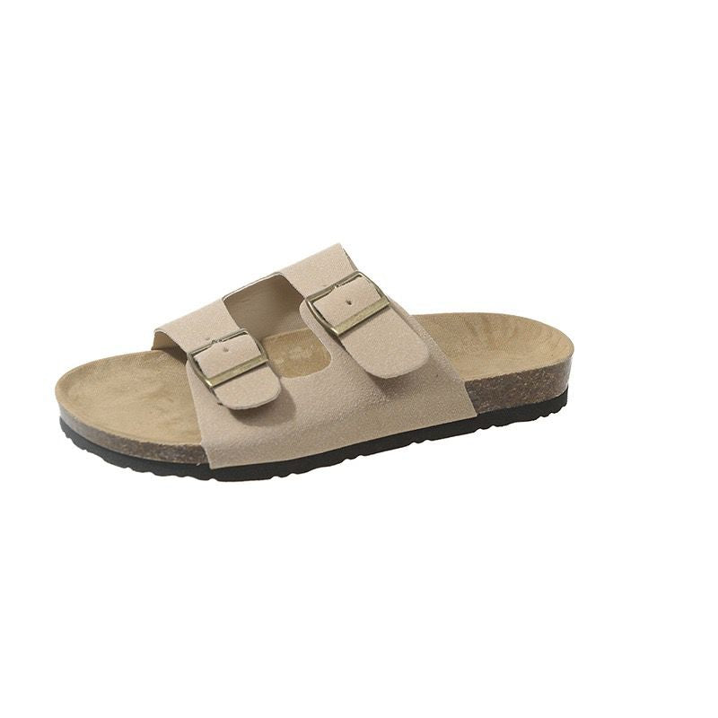Beige sandal with two straps on a white background