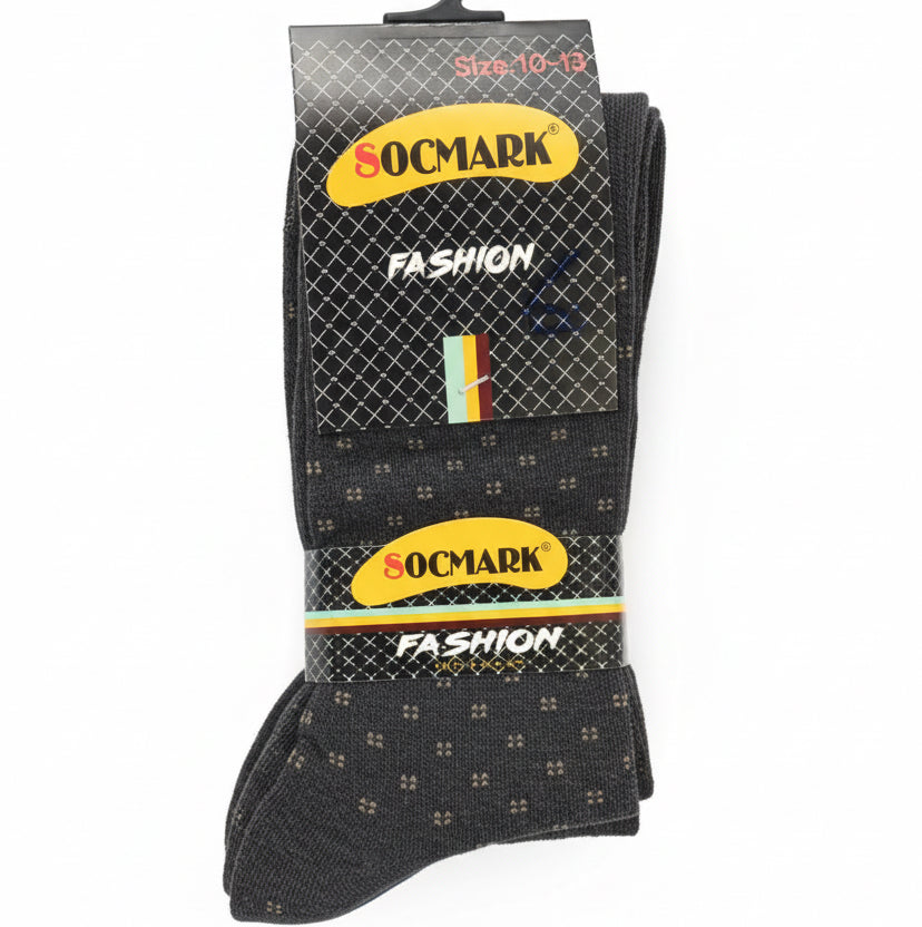 Pack of Soxmark fashion socks on a gray surface with blurred background