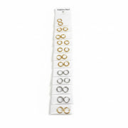 Set of gold earrings on a clear card against a white background