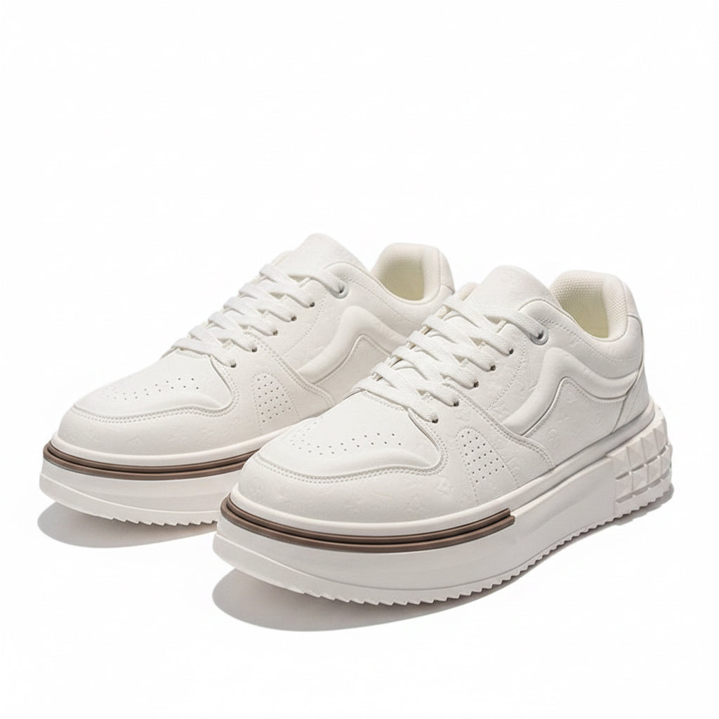 White sneakers with thick soles on a reflective surface