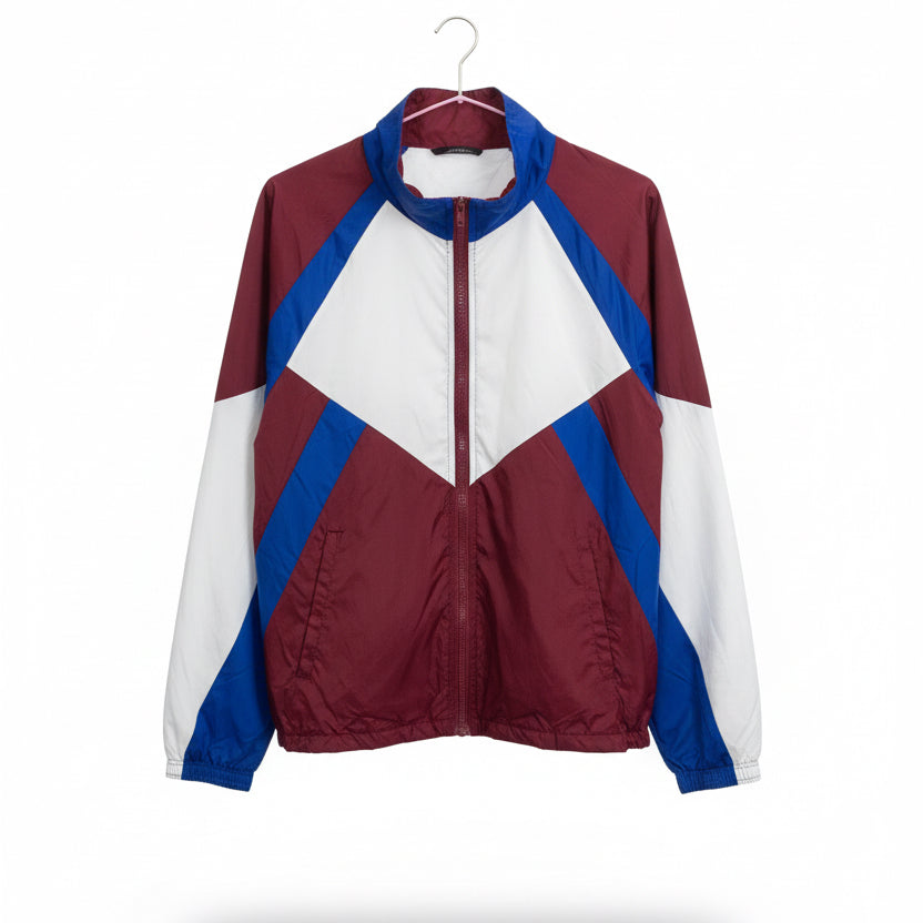 Maroon and white jacket with blue accents on a mannequin in a store setting.
