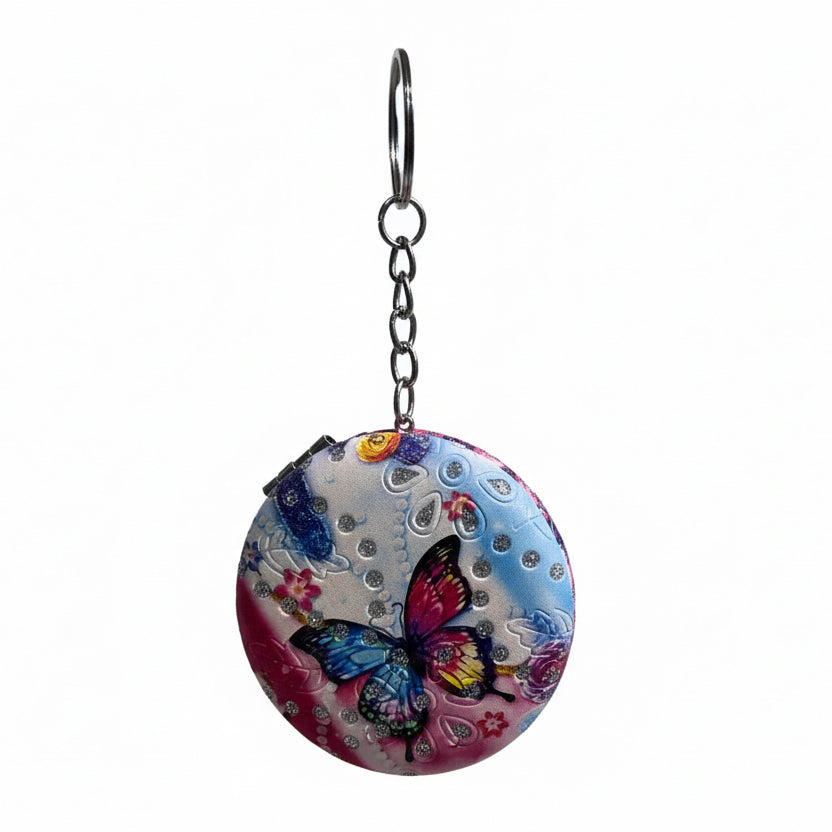 Cosmetic Mirror with butterfly design on a white background