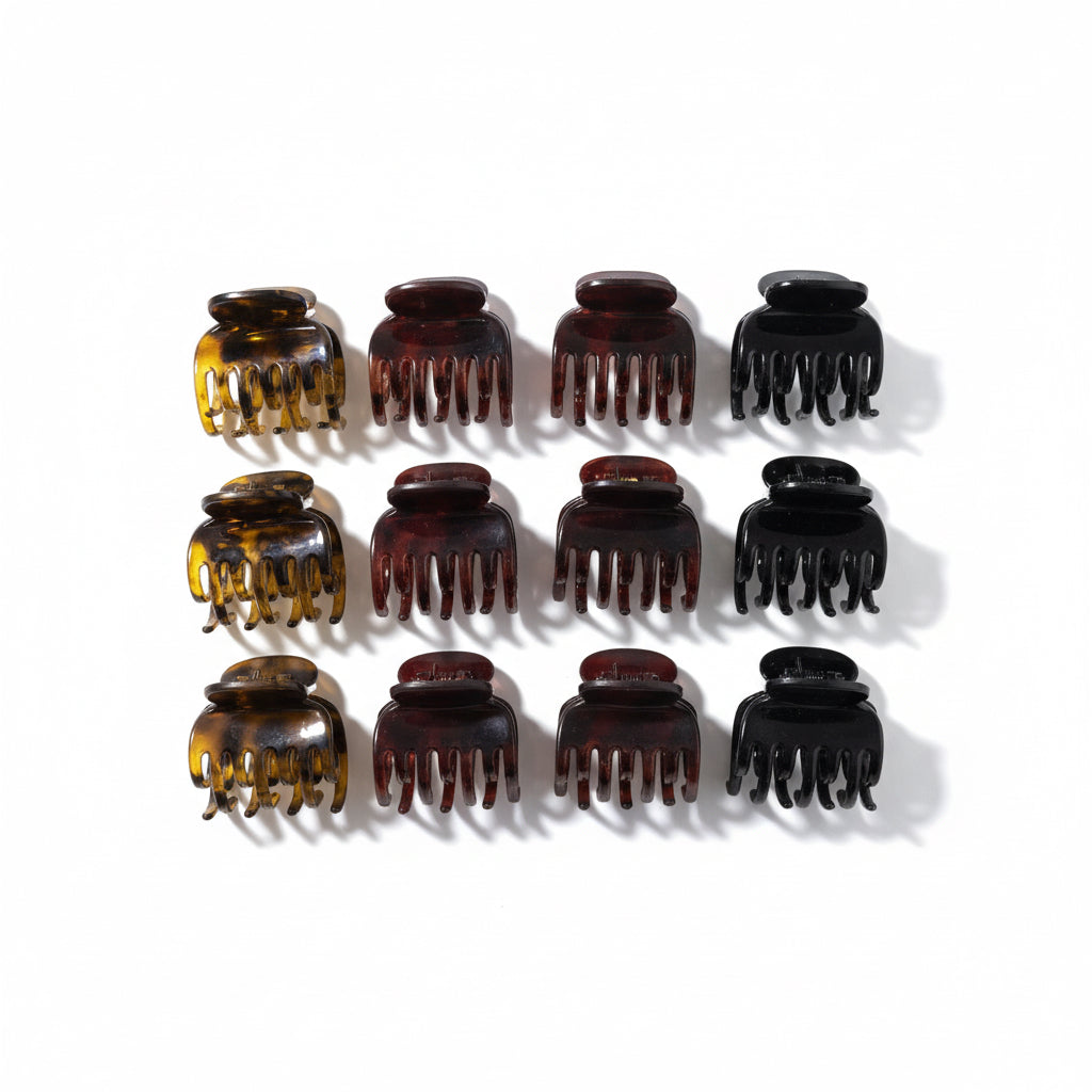 Set of twelve hair clamps in various colors on a white background