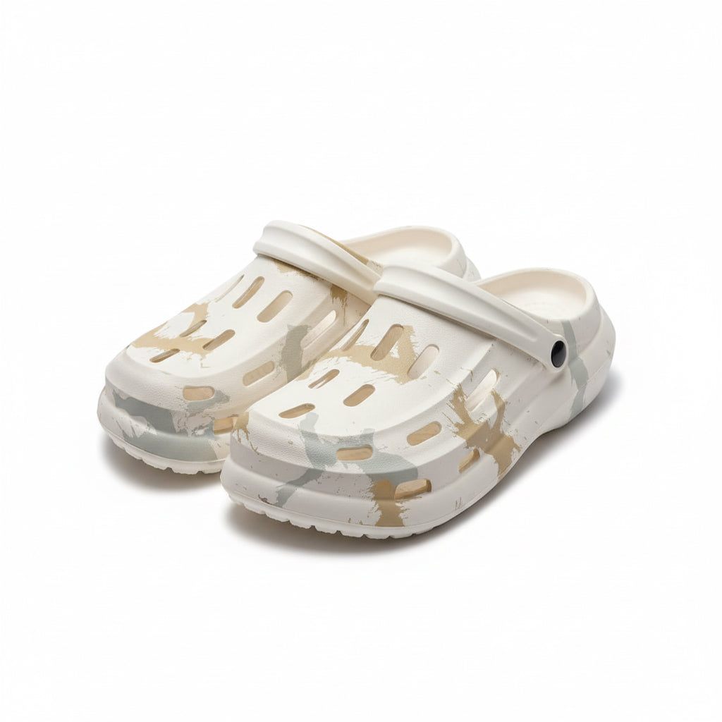 White clogs with brown design on a white surface
