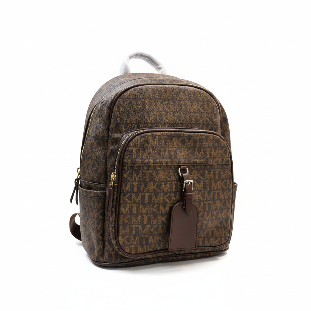 Brown patterned backpack held by a person with a blurred background