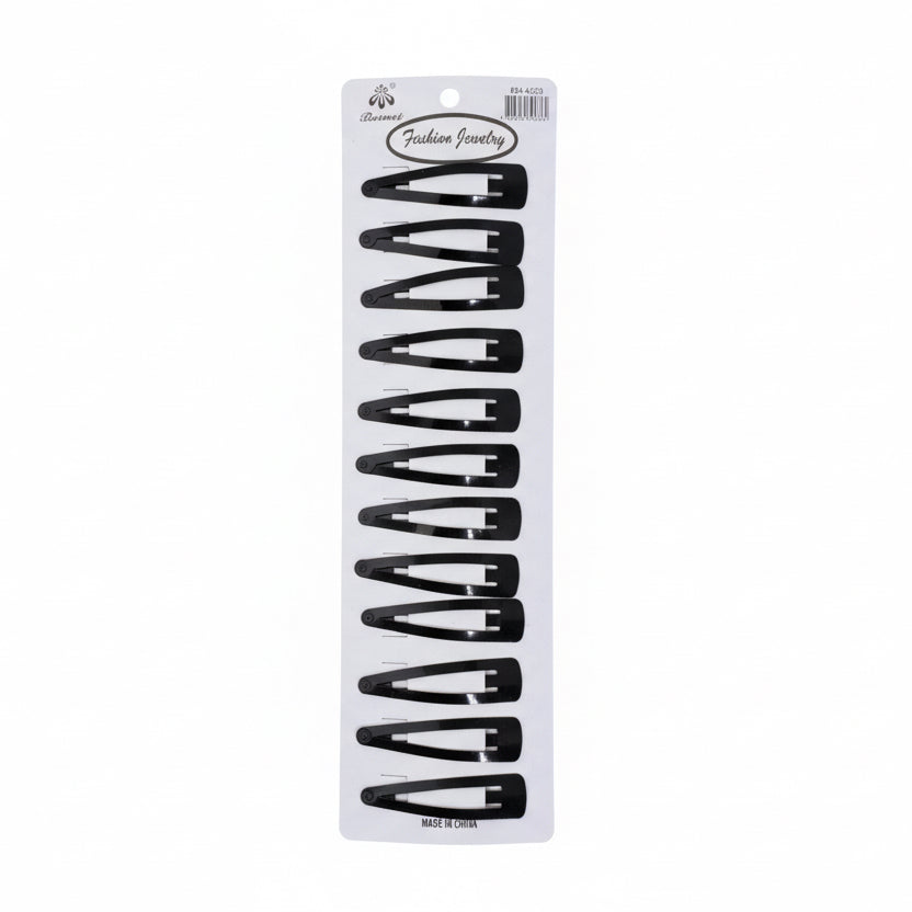 Set of black hair clips on a white card with brand logo