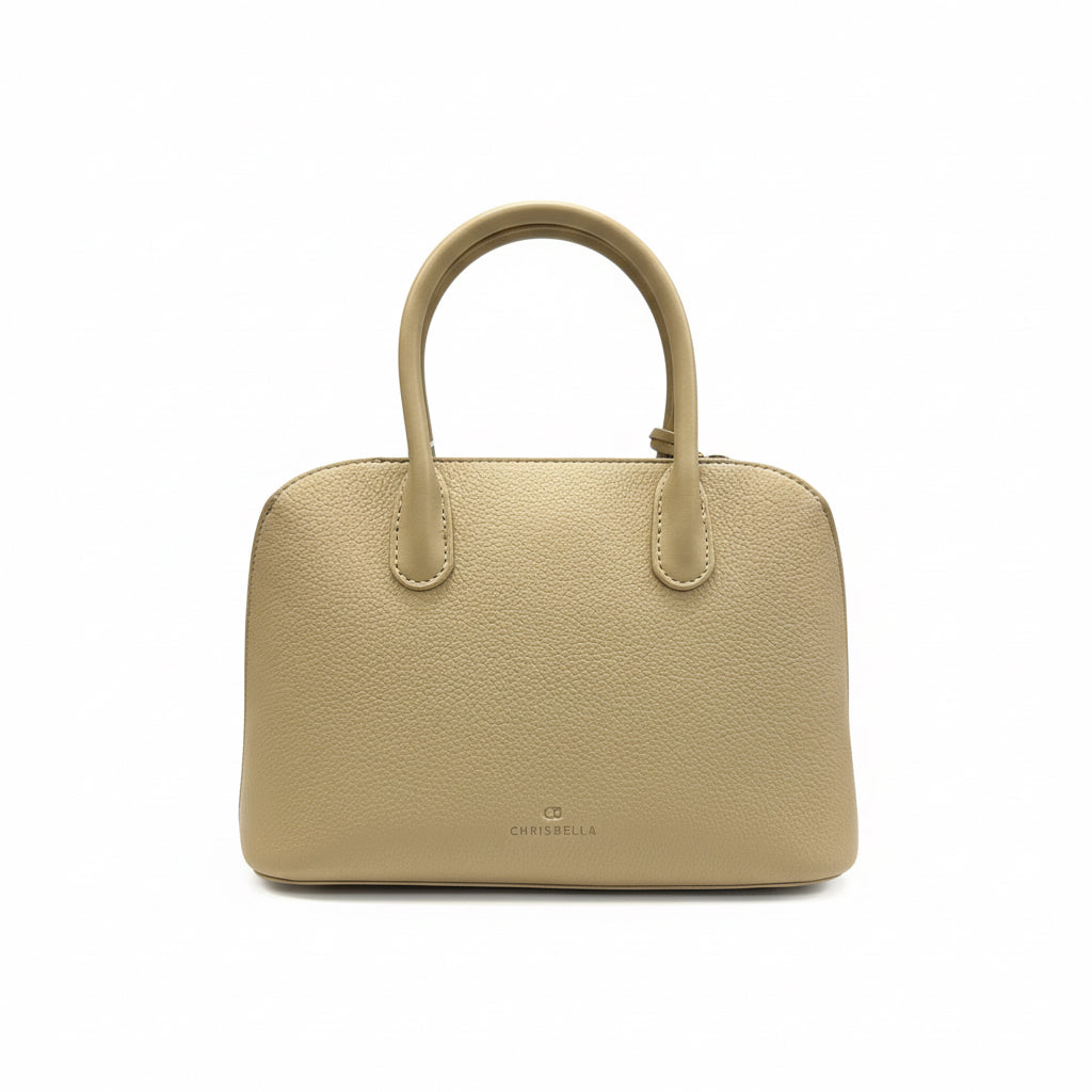 Beige handbag with a green handle on a white surface