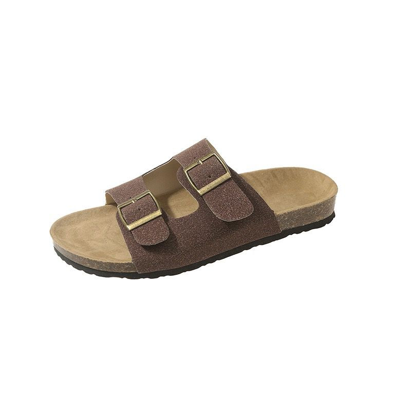 Brown sandal with two buckles on a white background
