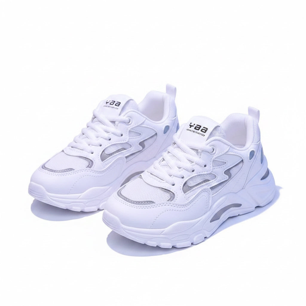 White sneakers with brand logo on a dark background
