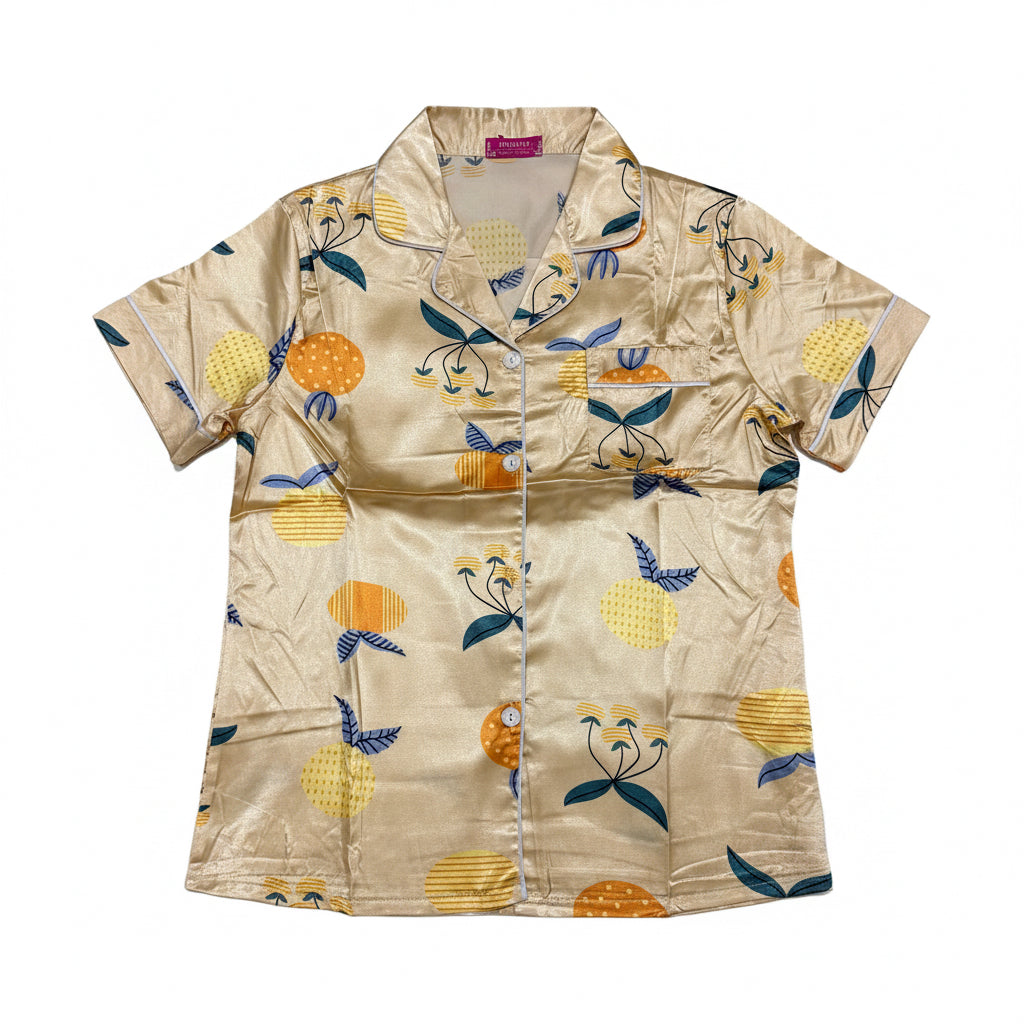 Beige shirt with colorful fruit pattern on a white background