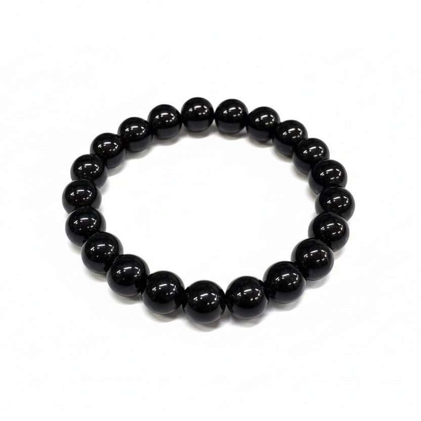 Black beaded bracelet on a white background