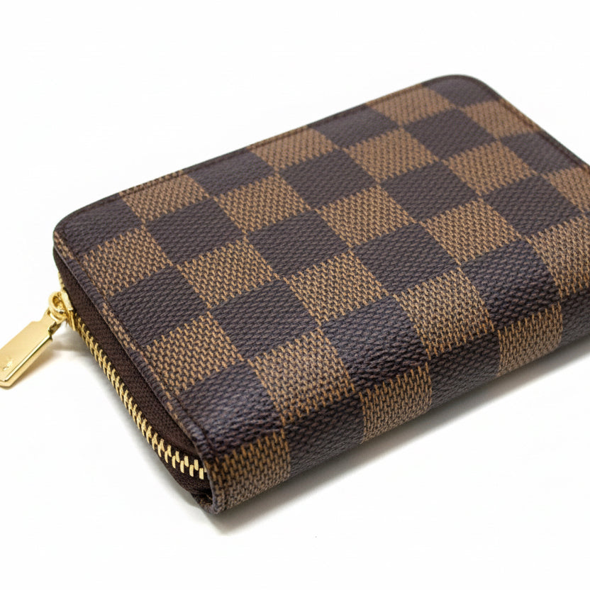 Checkered wallet with gold zipper on a white background