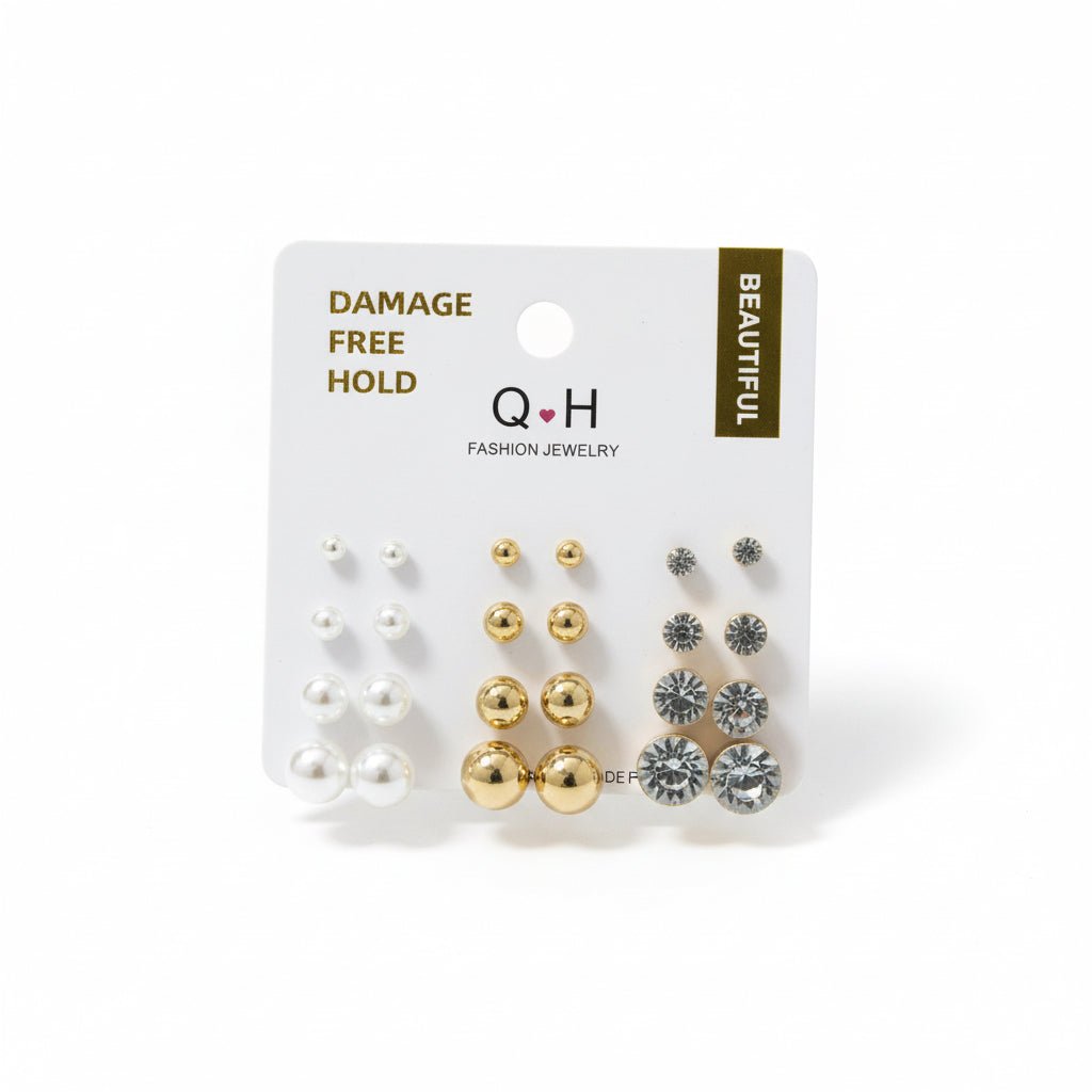 Set of earrings in a Q&H packaging on a white background