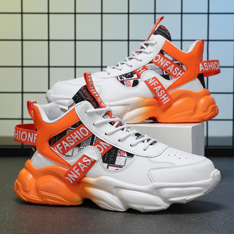 White sneakers with orange and red accents on a tiled floor background