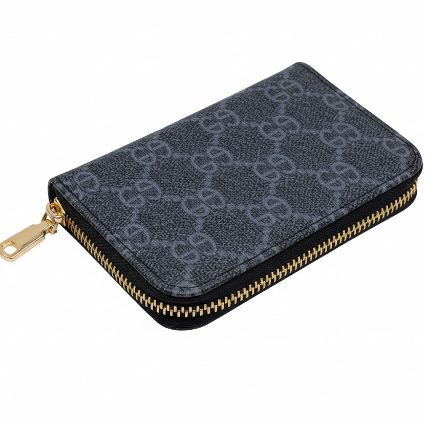 Black patterned wallet with gold zipper on a white background