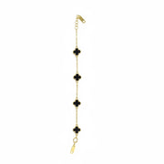 Gold chain earring with black clover-shaped stones on a white background