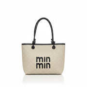 Woven handbag with black handles and 'min min' branding on a light background