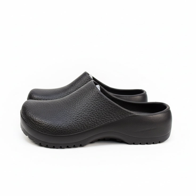 Pair of black clogs on a white background