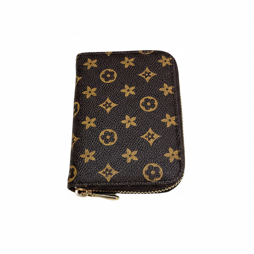 Designer wallet with monogram pattern on a white background