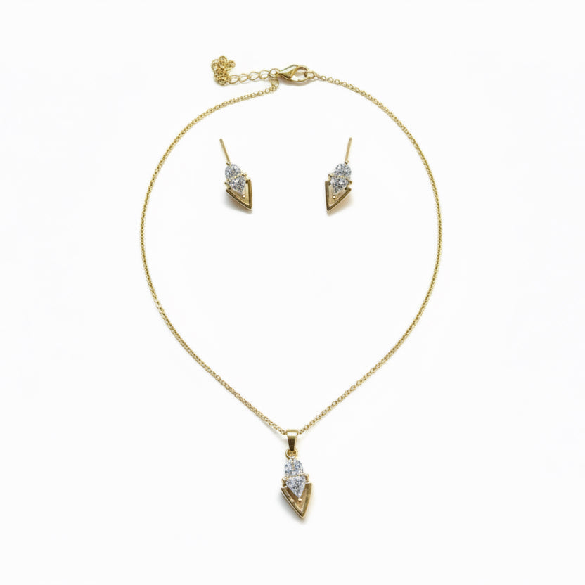 Gold necklace and earrings set on a white background