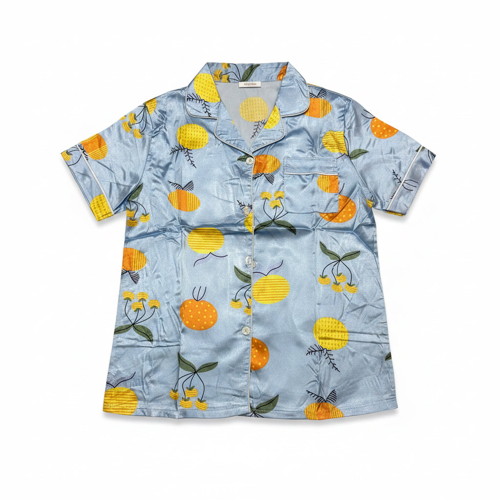 Short-sleeve shirt with fruit pattern on a light blue background