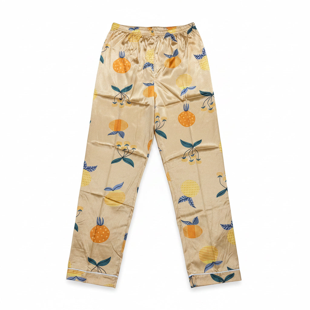 Beige pajama pants with fruit pattern on a white background