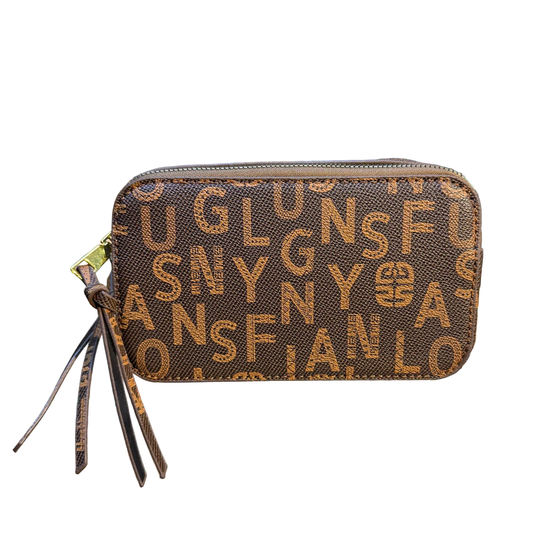 Patterned handbag on a glass surface with a blurred background