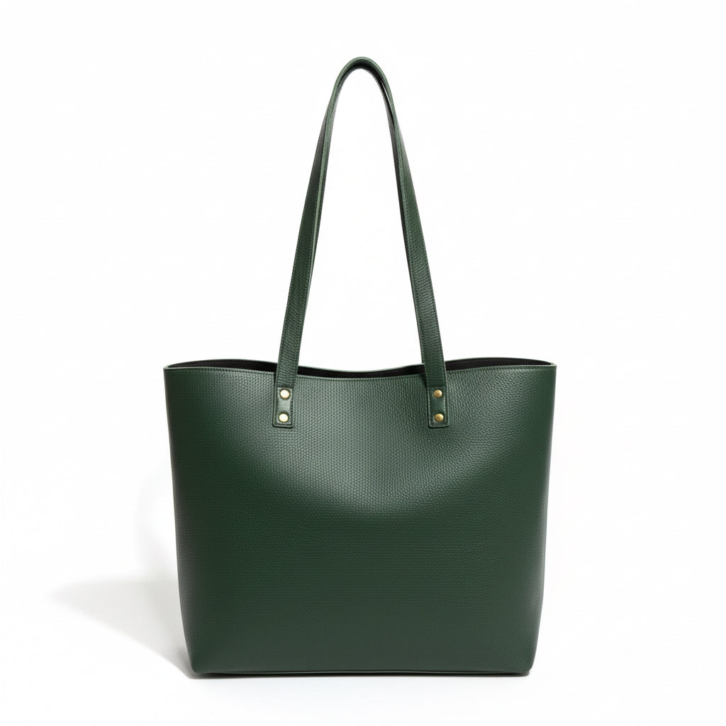 Green tote bag held by a hand on a light wooden surface