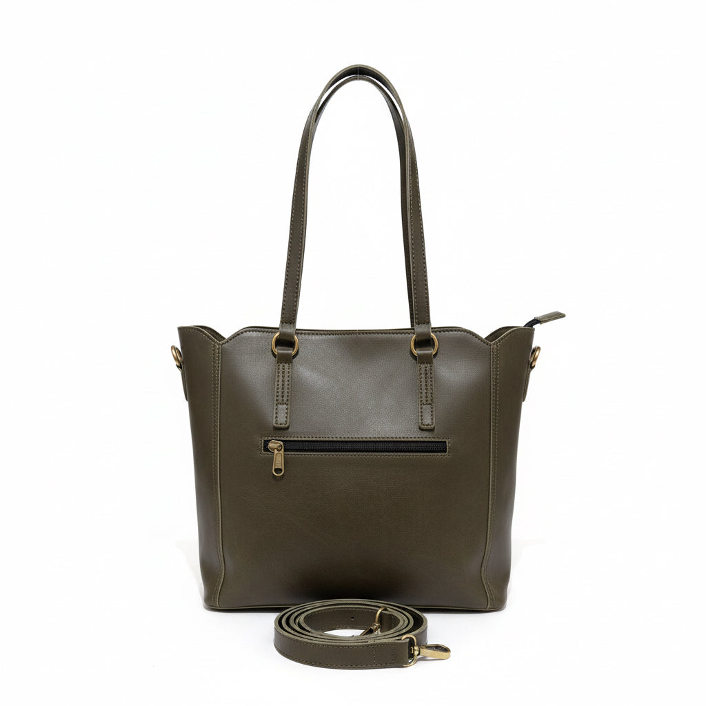 Brown leather handbag on a wooden surface with a white appliance in the background