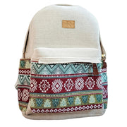 Front view of a ROLO backpack with a cream herringbone base and a vibrant multi-colored tribal geometric print on the front pocket and sides, featuring a brown leather-style logo patch on a plain white background.