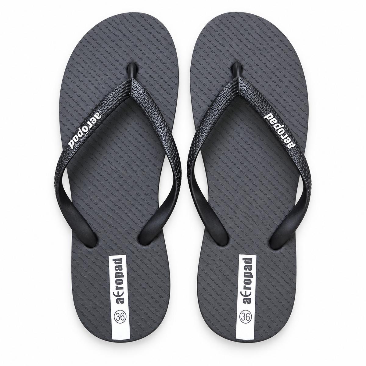 Aeropad black flip flops with textured footbed and black thong straps, size 36