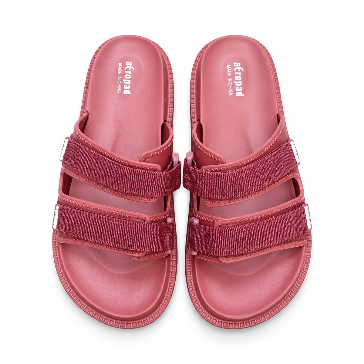 Top view of Aeropad pink dual strap adjustable casual slides with molded footbed.