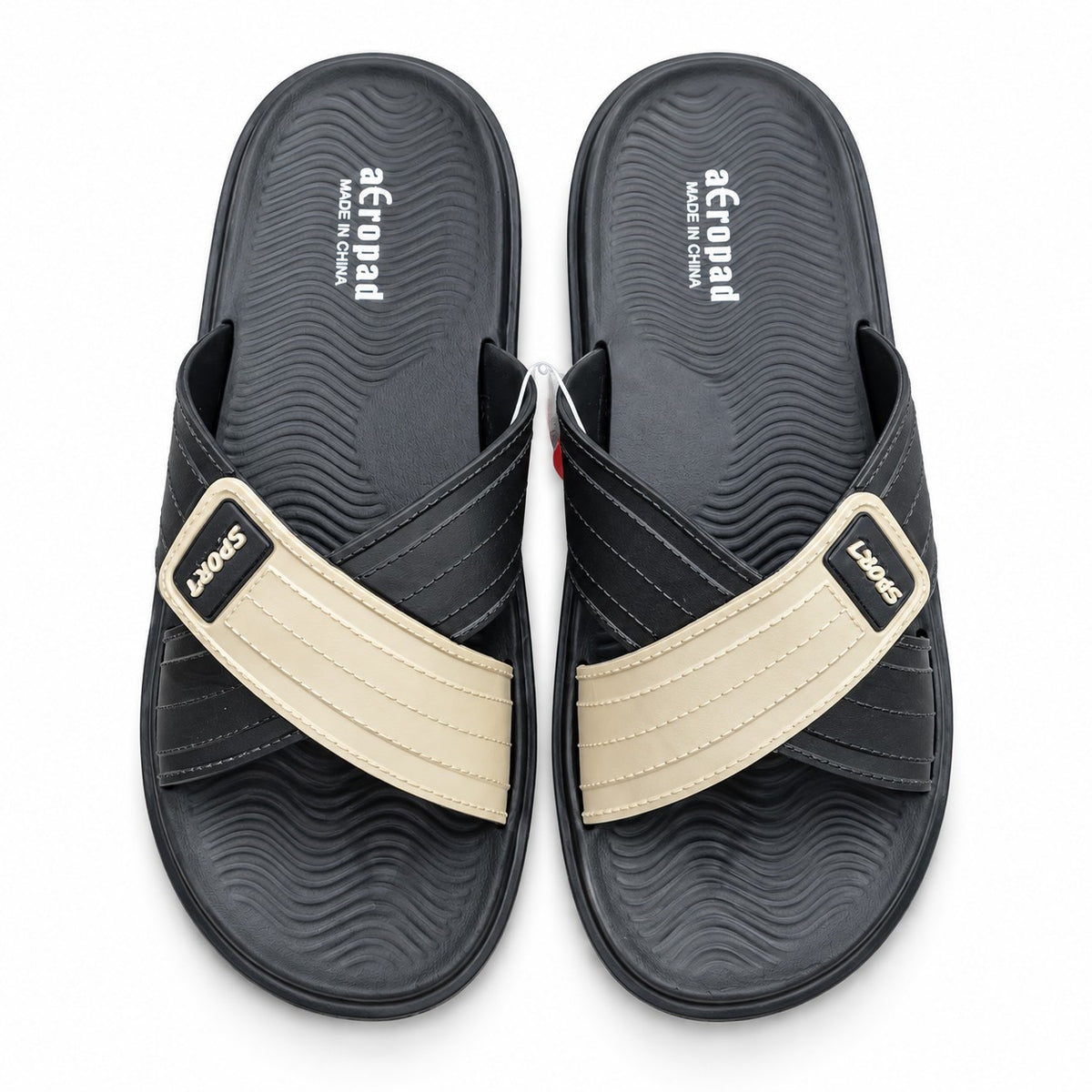Top view pair of Aeropad men's black and beige criss-cross strap casual slides with wave-textured footbed.