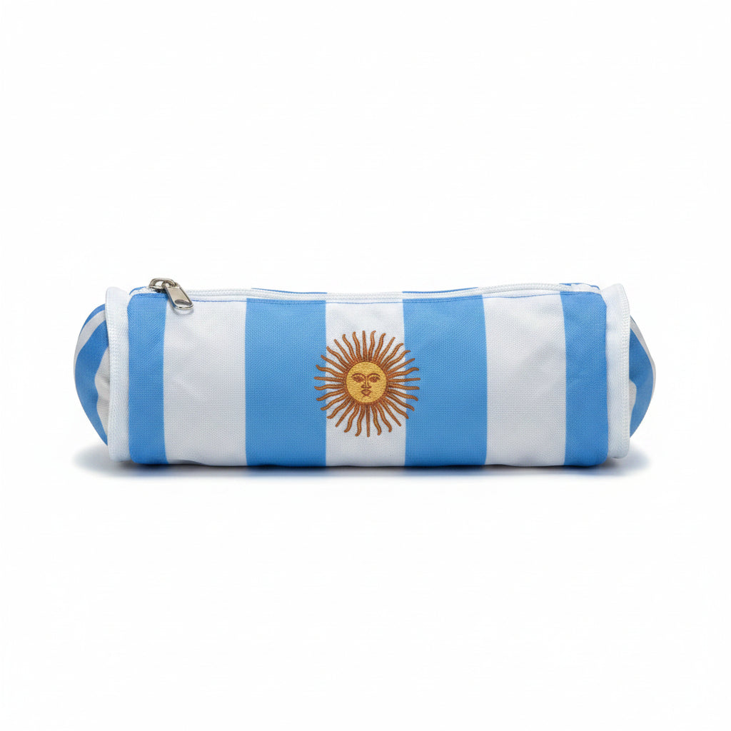 Front view of a cylindrical stationery pencil case decorated with light blue and white stripes and the Argentina sun emblem.