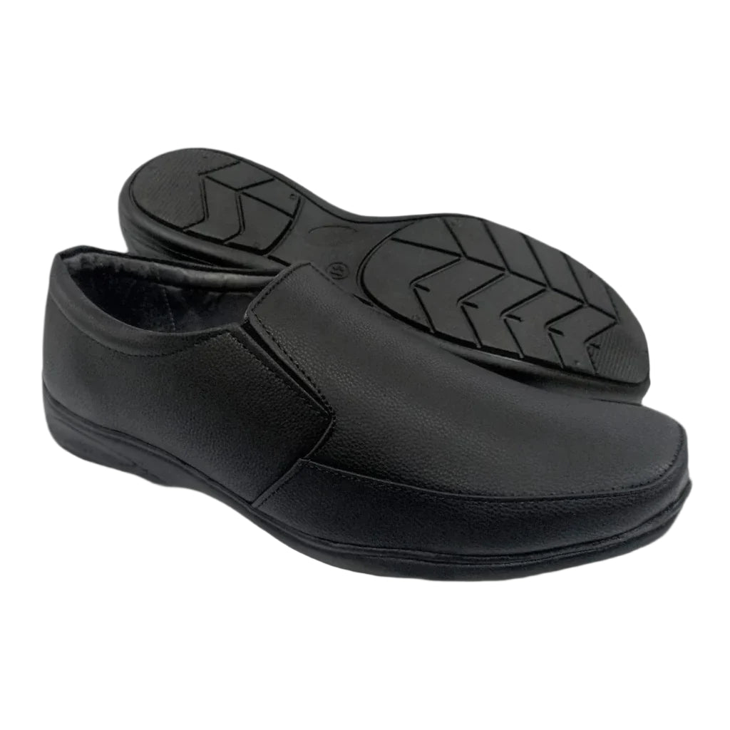 Black men’s slip-on formal shoes with textured upper and patterned outsole