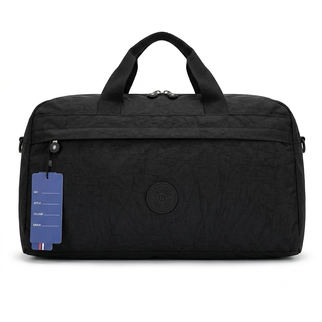 A black textured nylon duffel bag with dual top handles, a front zippered pocket, and a blue product tag hanging from the zipper, shown against a plain white background.