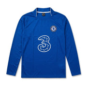 A royal blue long-sleeve Chelsea football jersey with a white outline of the 3 logo on the front and the Chelsea club crest on the left chest, displayed against a plain white background.