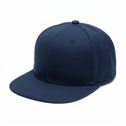 A classic six-panel flat-brim baseball cap in solid navy blue, photographed from a three-quarters angle on a clean white background.