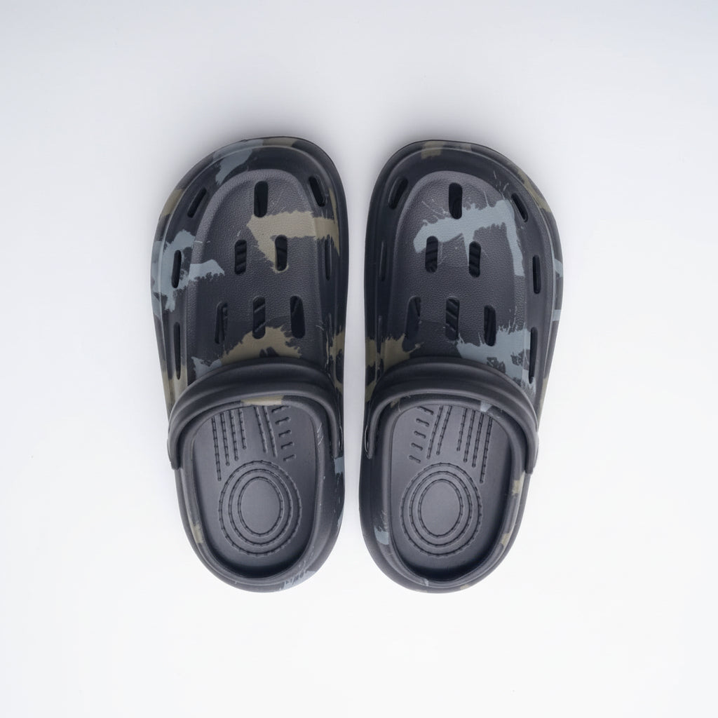 Black and gray camouflage-patterned clogs on a white surface