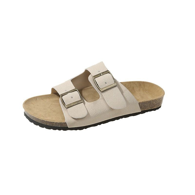 Beige sandal with two straps on a white background